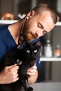 Veterinarian examines black cat, health care for pets. Animals care