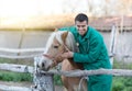 Veterinarian with horse