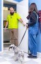 Veterinarian receiving a client with her pet