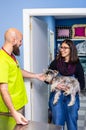 Veterinarian receiving a client with her pet