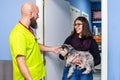 Veterinarian receiving a client with her pet