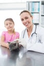 Veterinary and girl with kitten in clinic Royalty Free Stock Photo