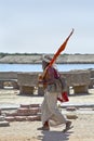 Religious Hindu man walking carrying flag