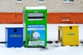 Multicolored containers for separate collection of garbage on city street