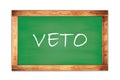 VETO text written on green school board