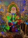 VETRALLA, ITALY - OCTOBER 23, 2022: Portrait of Santa Claus sitting in the throne during christmas time at the reign of Santa Clau