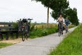 Veurne, West Flanders Region - Belgium - Recreative cycling path with biking couple