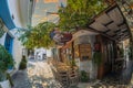 Vew of the narrow streets, traditional taverns, Greek Mediterranean architecture, Skiathos old town, Greece Royalty Free Stock Photo