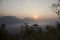 Vew of phu tok mountain with mist and sun at viewpoint in morning Royalty Free Stock Photo