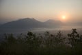 Vew of phu tok mountain with mist and sun at viewpoint in morning Royalty Free Stock Photo