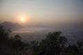 Vew of phu tok mountain with mist and sun at viewpoint in morning Royalty Free Stock Photo