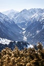 Vew from top of slope on snow capped mountains. Karakol ski resort in Kyrgyzstan