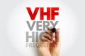 VHF Very High Frequency text with a hand holding a marker on a light background, modern technology abbreviation concept for Royalty Free Stock Photo