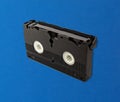 VHS tape cassette isolated over blue