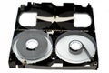 VHS video cassette tape from inside with the front casing removed showing supply and take up reels and is made of plastic that was Royalty Free Stock Photo