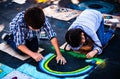 Via Arte-Child Artists creating chalk art on streets Royalty Free Stock Photo