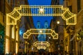 Via dei Condotti leading to Piazza di Spagna. Christmas time in Rome, Italy.