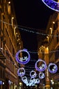 Via De `Tornabuoni in the evening illuminated with lights and Christmas lights in Florence. Royalty Free Stock Photo
