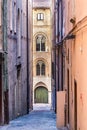 The Via degli Aranci, a narrow - alleway street with old bricks walls in the city center of Ancona, Italy