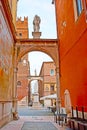 Via delle Fogge street with a view of Dante Monument in Piazza dei Signori square, Verona, Italy Royalty Free Stock Photo