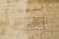 The Via Dolorosa sign on the stone wall in the old city of Jerusalem , Israel