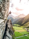 Via ferrata climber climbs vertical rock, Reinhard Schiestl Klettersteig, Austria