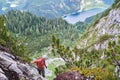 Via ferrata tourist looking down towards lake Gosau Gosauseen while climbing the via ferrata route called Intersport. Royalty Free Stock Photo