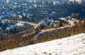 Viaduct in city district Hlubocepy and building, from snowy meadow, Prague Royalty Free Stock Photo