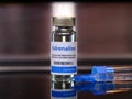 Vial of adrenaline injection with syringe
