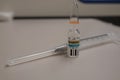 A vial of epinephrine / adrenaline and a syringe