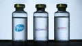 Vials of covid-19 vaccine with blurred Pfizer, Astrazeneca and Moderna logos blurred on the background