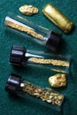 Vials of Gold Dust and Gold Nuggets Royalty Free Stock Photo