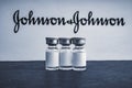 Vials vaccine on blurry Johnson & Johnson background