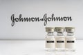 Vials vaccine on blurry Johnson & Johnson background