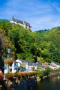 Vianden Castle on a hill with houses and Our river in Vianden, Luxembourg Royalty Free Stock Photo