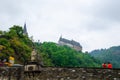 Vianden, Luxembourg - July 27, 2019: Vianden Castle on a hill with a bridge, a restaurant and Our river in Vianden, Luxembourg Royalty Free Stock Photo