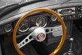 Vianden, Luxembourg; 08/12/2018: view of the steering wheel and speedometer in the interior of a MG MGB, a vintage old classic