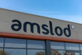 Amslod logo sign above the bike store entrance.