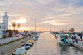 Sunset on dock and lighthouse, port of Viareggio (Tuscany)