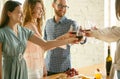 People clinking glasses with wine or champagne. Happy cheerful friends celebrate holidays, meeting. Close up shot of Royalty Free Stock Photo