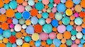 A vibrant abstract pattern featuring an array of overlapping circles in various bright colors.