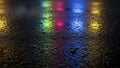 Vibrant abstract reflections of colorful lights on wet asphalt at night creating a mesmerizing and dynamic visual effect Royalty Free Stock Photo