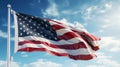 A vibrant American flag waving against a clear blue sky