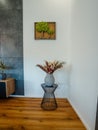 Vibrant array of beautiful flowers in a classic ceramic vase on a modern living room table