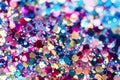 Colorful glittering confetti scattered on a surface, creating a festive atmosphere for Christmas and New Year Royalty Free Stock Photo