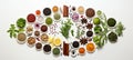 Vibrant array of colorful spices, aromatic herbs, and kitchen utensils on white backdrop Royalty Free Stock Photo