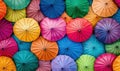 A vibrant array of colorful umbrellas seen from above, forming a dense textured pattern of radiating lines and vivid hues Royalty Free Stock Photo