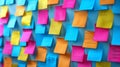 Vibrant array of multicolored sticky notes arranged in a chaotic pattern on a turquoise backdrop
