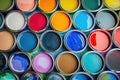 Vibrant array of open paint cans displaying a spectrum of colors for creative projects and home renovation Royalty Free Stock Photo