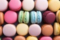 A vibrant array of pastel macaroons entice with their sweet confectionery charm